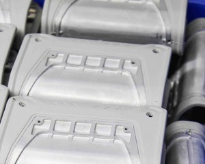 What is the purpose of wrapping liquid silicone on a metal shell?