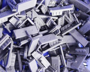 What is the core function of liquid silicone USB plugs in consumer electronics?